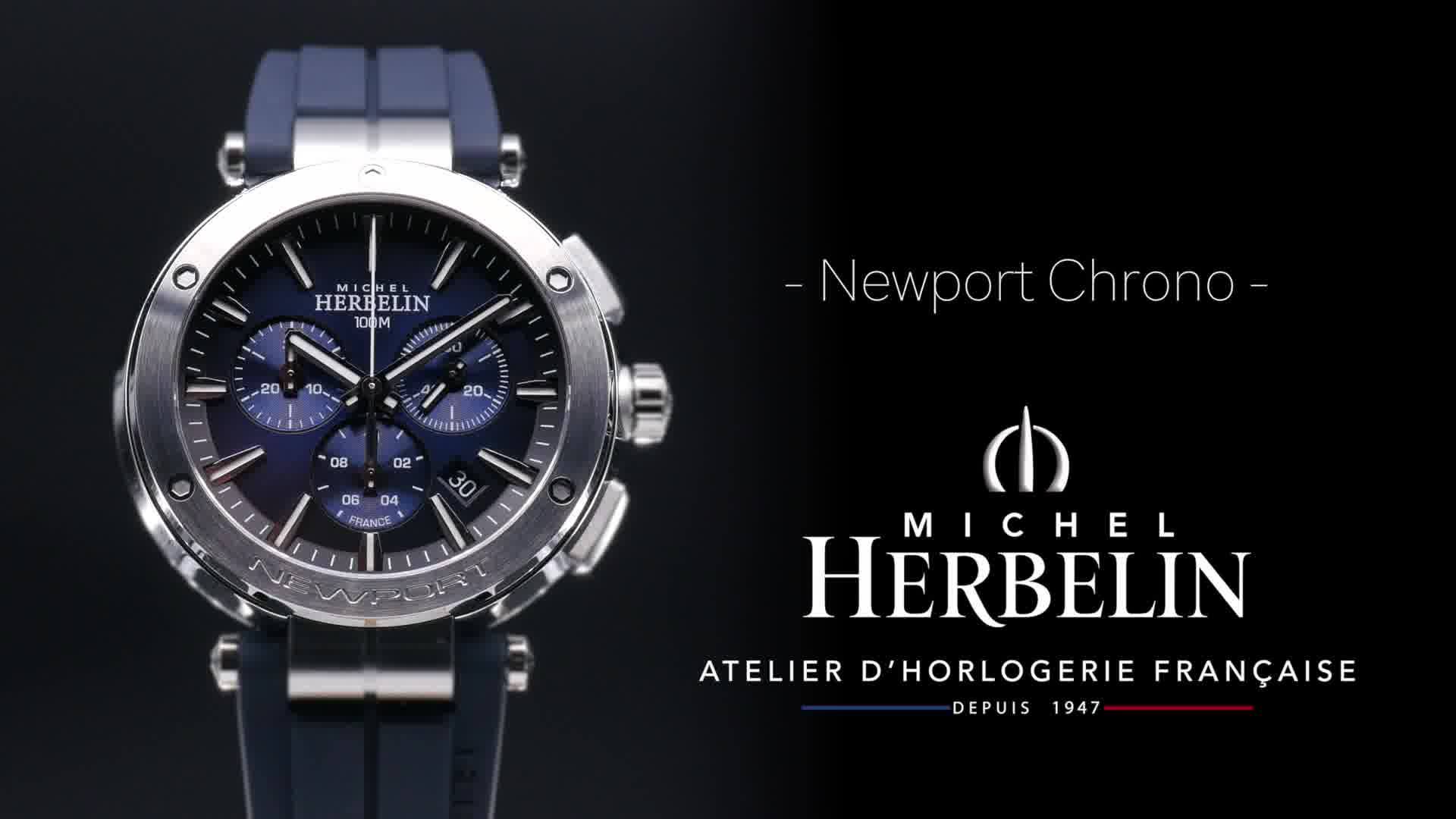 Eine elegante Armbanduhr mit blauen Ziffern und einem silbernen Gehäuse, präsentiert als Newport Chrono von Michel Herbelin. Logo und Schriftzug sichtbar.